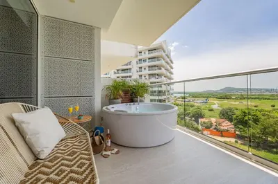a balcony with a bath tub and a large window at MQ903 | Jacuzzi & hamaca · Vista espectacular in Cartagena de Indias