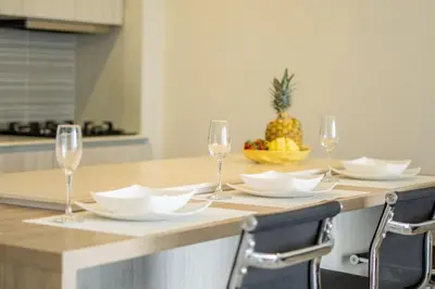a table with wine glasses and a pineapple on it at MQ903 | Jacuzzi & hamaca · Vista espectacular in Cartagena de Indias
