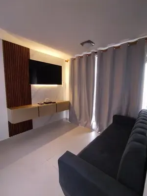 a living room with a couch and a flat screen tv at Sol y Brisa 811 in Cartagena de Indias