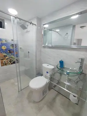 a bathroom with a toilet and a glass sink at Sol y Brisa 811 in Cartagena de Indias