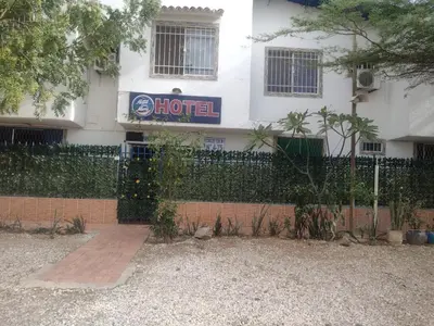 a hotel sign on the side of a building at Casa Hotel Marly in Santa Marta