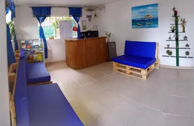 a play room with a slide and a blue chair at Casa Hotel Marly in Santa Marta