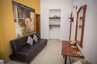 a living room with a couch and a table at Hotel Casa Tere in Cartagena de Indias