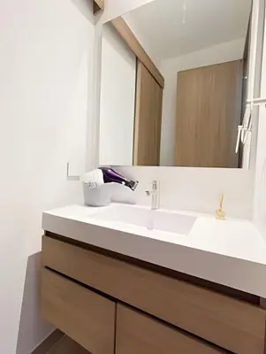 a bathroom with a sink and a mirror at Vista a Laguna de Kristal + Bote inflable in Los Arrayanes