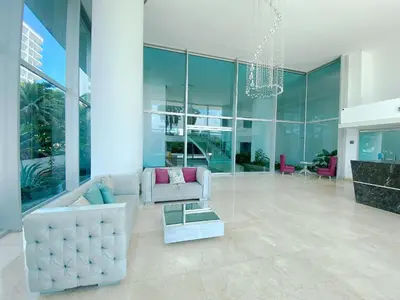 a living room with a couch and a table at Apartamento 1 dormitorio Morros. Vista Mar y Acceso Playa in Cartagena de Indias