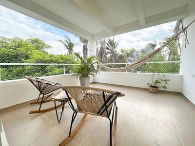 a balcony with two chairs and a table at Apartment for 6 Guests in Sabanilla a Few Steps from the Sea in Maizal