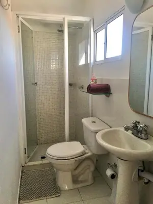 a bathroom with a toilet and a shower and a sink at Cartagena - stunning location in walled city in Cartagena de Indias