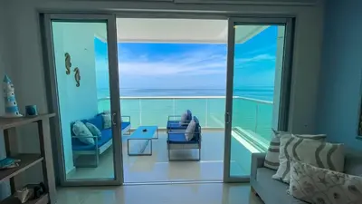 a living room with a view of the ocean at Magico Apartamento Frente al Mar 3 Habitaciones AR134 in Coveñas