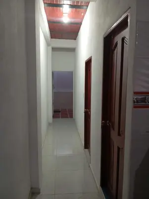 an empty hallway with a door and a hallwayngthngthngthngthngthngthngth at Apartamentos el farol in Ciénaga
