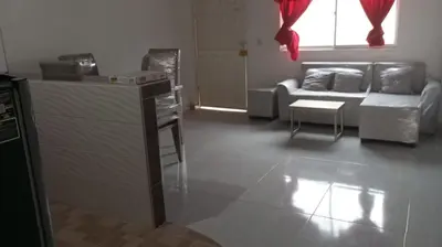 a living room with a couch and a table at Apartamentos el farol in Ciénaga