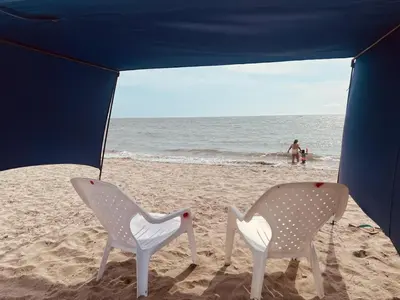 two chairs sitting in the sand on the beach at Villa Colibrí in Santa Marta