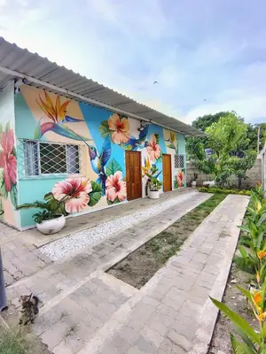 a house with a mural on the side of it at Villa Colibrí in Santa Marta