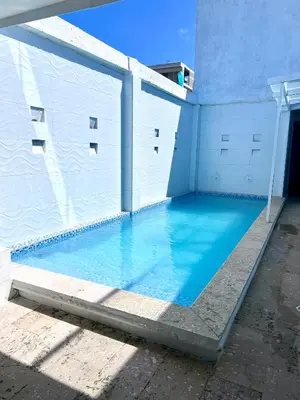 a swimming pool in a building with blue water at Open Sea Hotel Cartagena - Frente al mar in Cartagena de Indias
