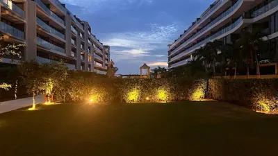 a large yard with lights in front of a building at Luxury 2-Bedroom Apartment with Breathtaking Ocean Views in Cartagena de Indias