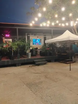 a building with a tent and a tv and plants at Los paragüitas in Cartagena de Indias
