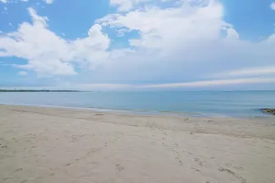 a sandy beach with the ocean in the background at Magico Apartamento Frente al Mar 3 Habitaciones TR52 in Coveñitas
