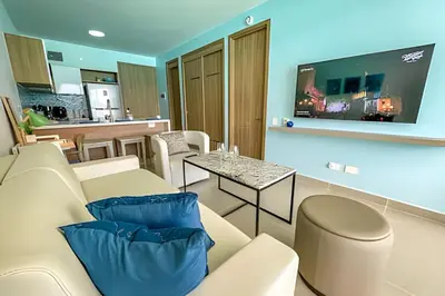 a living room with a couch and a table at 1 Alcoba Hermosa vista a la laguna + bote inflable in Los Arrayanes