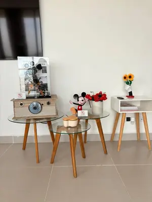 a room with two tables and a table with flowers at Exclusive apartment with ocean view in Cartagena de Indias