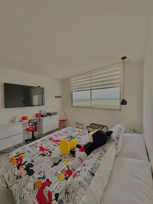 a bedroom with a bed with stuffed animals on it at Exclusive apartment with ocean view in Cartagena de Indias
