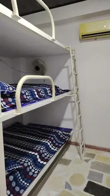 a room with two bunk beds in a room at CARTAGENA BOQUILLA BEACH HOSTEl in Cartagena de Indias