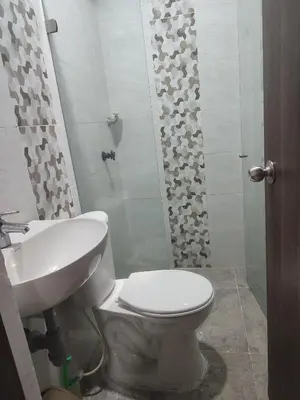 a bathroom with a toilet and a sink at Torices casa hostal 47 in Cartagena de Indias