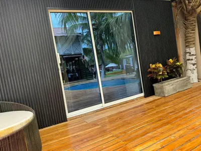 a room with a sliding glass door with a patio at Hospedaje de lujo baru in Playa Blanca