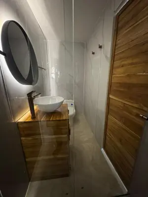 a bathroom with a sink and a mirror at Hospedaje de lujo baru in Playa Blanca