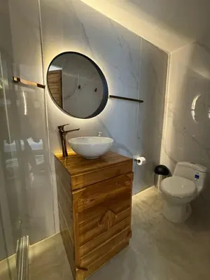 a bathroom with a sink and a mirror and a toilet at Habitaciones luxury baru in Playa Blanca