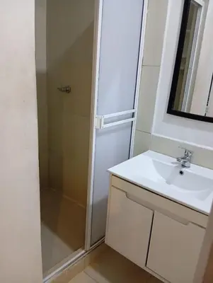 a bathroom with a sink and a shower at Hotel Nativo Manzanillo in Cartagena de Indias