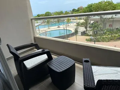 a balcony with a view of a swimming pool at Apartamento de lujo en Santa Marina Santa Marta in Santa Marta