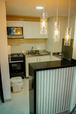 a kitchen with a sink and a toilet in it at Apartamento Laguito Cartagena in Cartagena de Indias