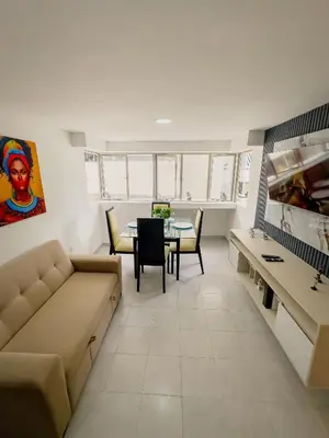 a living room with a couch and a table at Apartamento Laguito Cartagena in Cartagena de Indias