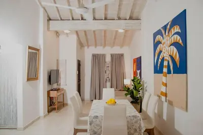 a dining room with a table and chairs at Comfortable apartment in the historic center in Cartagena de Indias