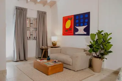 a living room with a couch and a coffee table at Comfortable apartment in the historic center in Cartagena de Indias