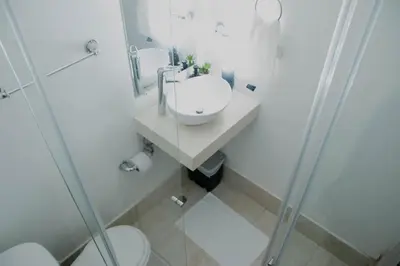 a bathroom with a sink and a toilet and a shower at Comfortable apartment in the historic center in Cartagena de Indias
