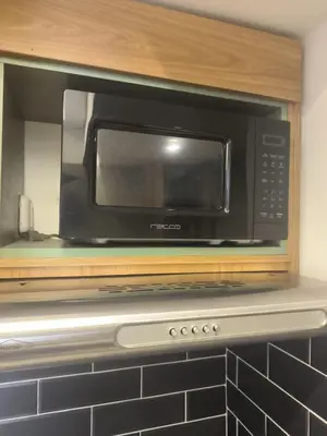 a microwave oven sitting on top of a kitchen counter at Apartamento Luxury en Cartagena con Vista al mar in Cartagena de Indias