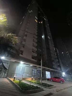 a red car parked in front of a building at night at Apartamento Luxury en Cartagena con Vista al mar in Cartagena de Indias