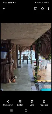 a page of a website with a view of a room at Hostal Ananda in Playa Blanca