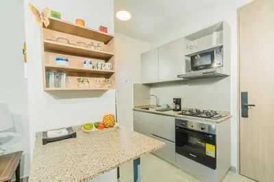 a kitchen with a counter top and a stove top oven at Elemnt Rentals in Santa Marta