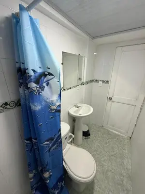 a bathroom with a toilet and a sink at Hermoso estudio en Cartagena edificio frente al mar in Cartagena de Indias