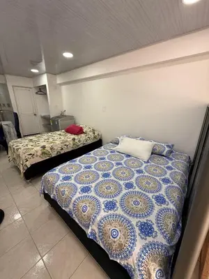 a bedroom with two beds in a room at Hermoso estudio en Cartagena edificio frente al mar in Cartagena de Indias