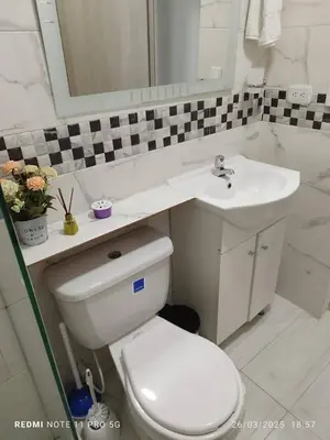 a bathroom with a white toilet and a sink at Apartamento turístico cerca al mar en Cartagena in Cartagena de Indias