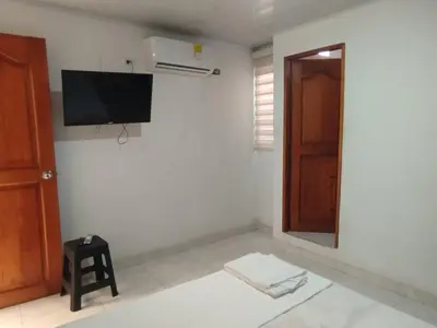 a room with a flat screen tv on a wall at Casa Turistica Parador Verona in Cartagena de Indias