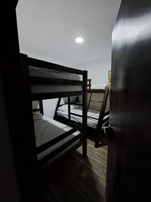 a pair of bunk beds in a room at HELENA Beach House in La Rada