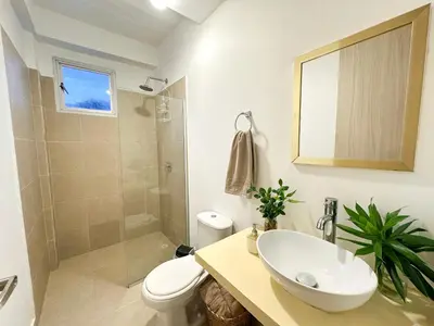 a bathroom with a sink and a toilet and a shower at Apartment for 4 Guests in Sabanilla a few steps from the sea in Maizal