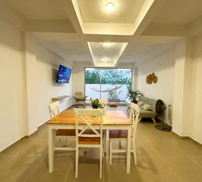 a dining room with a wooden table and chairs at Apartment for 4 Guests in Sabanilla a few steps from the sea in Maizal