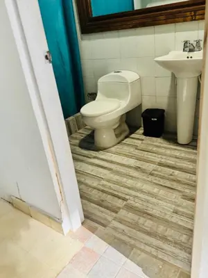 a bathroom with a toilet and a sink at Quinta San Gabriel House in Turbaco
