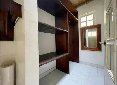 a room with wooden shelves and a window at Quinta San Gabriel House in Turbaco