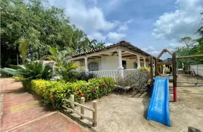 a house with a playground in front of it at Quinta San Gabriel House in Turbaco