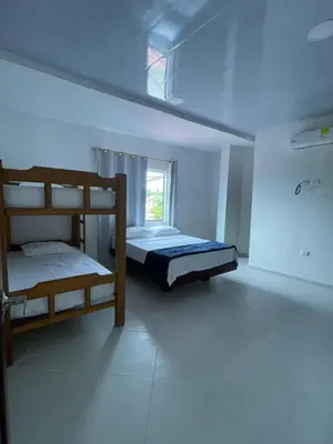 a bedroom with two bunk beds and a window at Apartamento Salome in Coveñitas